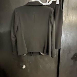 Woman’s petite skirt suit set.